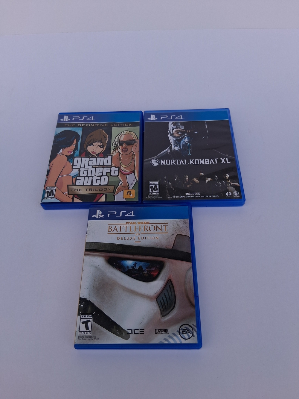 PS4 Grand Theft Auto Trilogy, Mortal Kombat XL,Star Wars Battlefront Deluxe Edi.